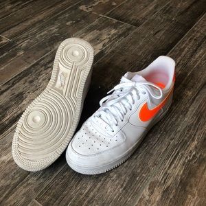 Nike Air Force 1’s with orange swoosh